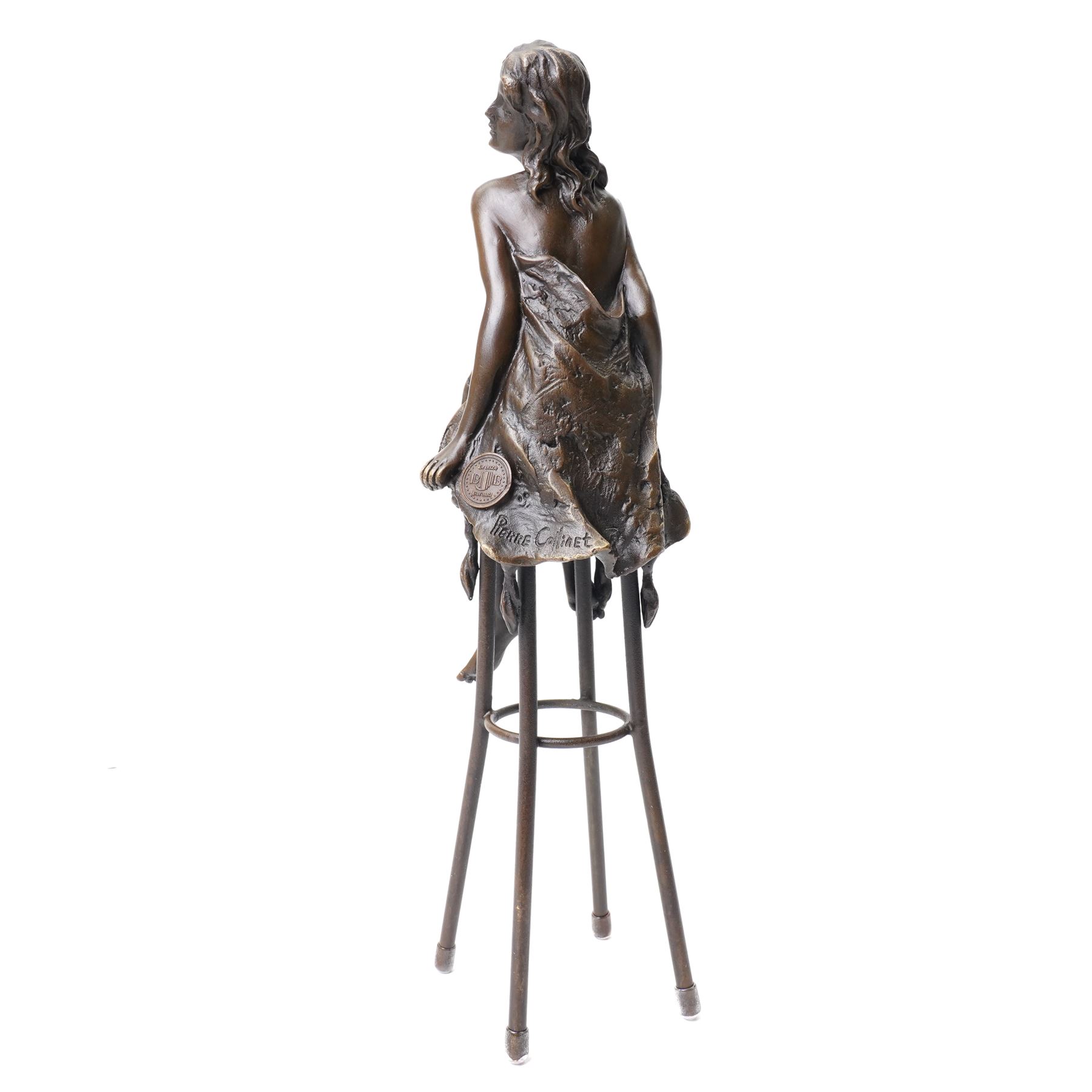 After Pierre Collinet - bronze modelled as a semi naked female figure, seated upon a chair, H27cm