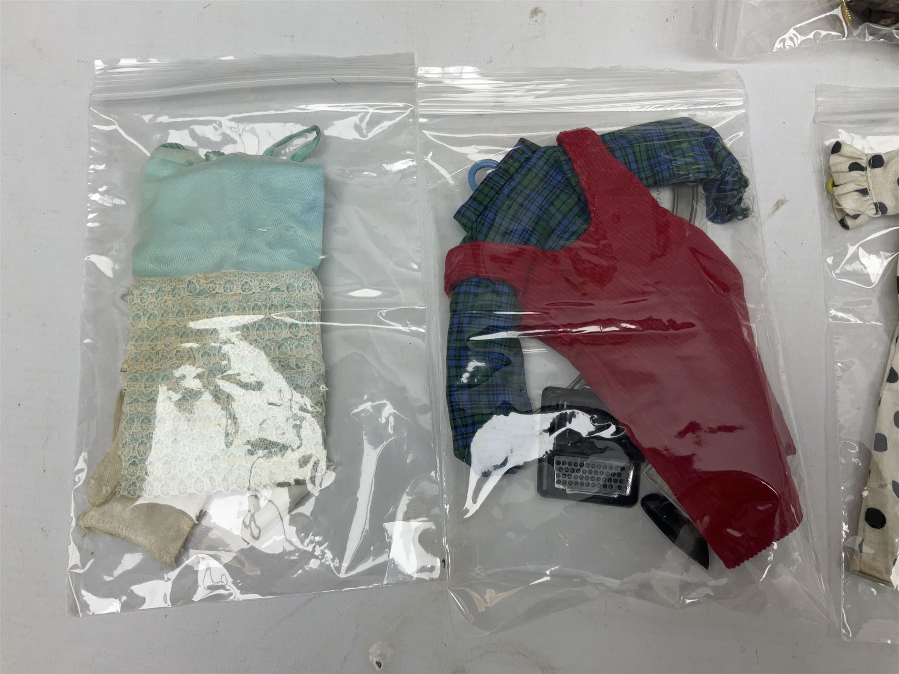 1960s Palitoy Tressy fashion doll, boxed with stand and booklets; four additional Tressy outfits (In The Office, Winter Journey, Winter Sports and Evening Date); two other outfits; and Tressy's Little Sister Toots doll with Style Book and additional outfit