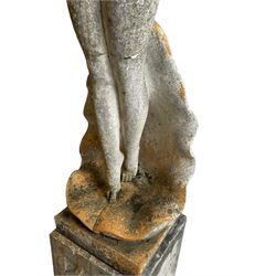 Cast stone two-piece garden figure of the Birth of Venus, depicting the goddess emerging from a stylised shell, on square base with stepped moulded plinth 