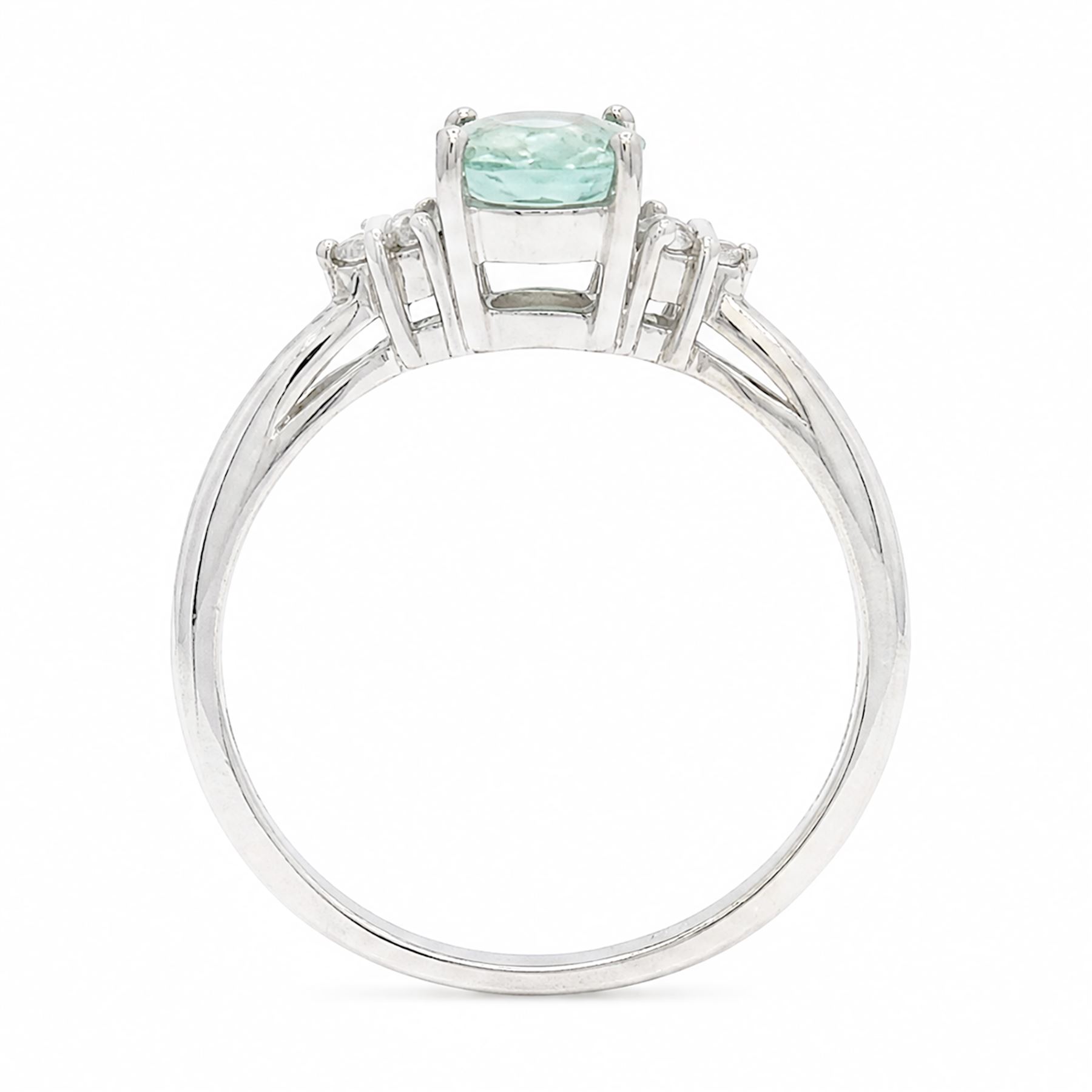 18ct white gold Paraiba tourmaline and diamond ring, single oval cut tourmaline of approx 0.95 carat, with three round brilliant cut diamonds set either side, Birmingham 2008