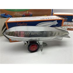 Schylling - six tinplate models comprising Sir Ian’s Bluebird racing car, Speedway Auto Racer, two Aluminium Airships, Tin Speedboat and Ernest in the Music Box; all in original boxes 