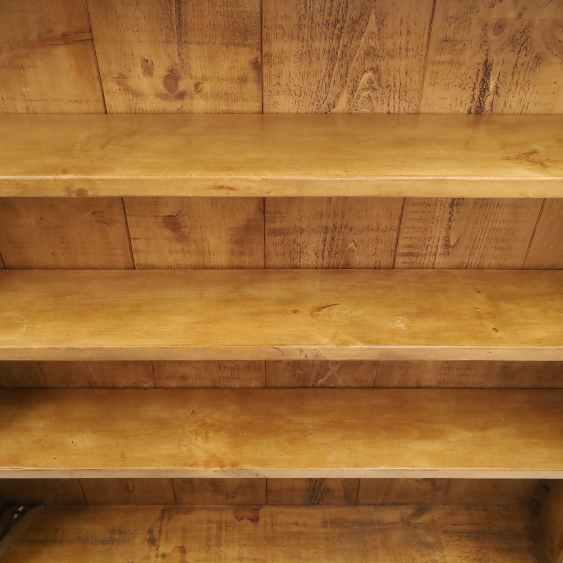 Indigo Furniture - large rustic oak open bookcase, with four adjustable shelves, above a plinth base 