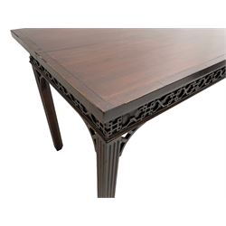 In the manner of Thomas Chippendale - early 19th century mahogany serving table, rectangular crossbanded top with boxwood stringing, the frieze with upper moulding over applied geometric fretwork, the left-hand side fitted with slide, on fluted square supports with inner chamfer 
