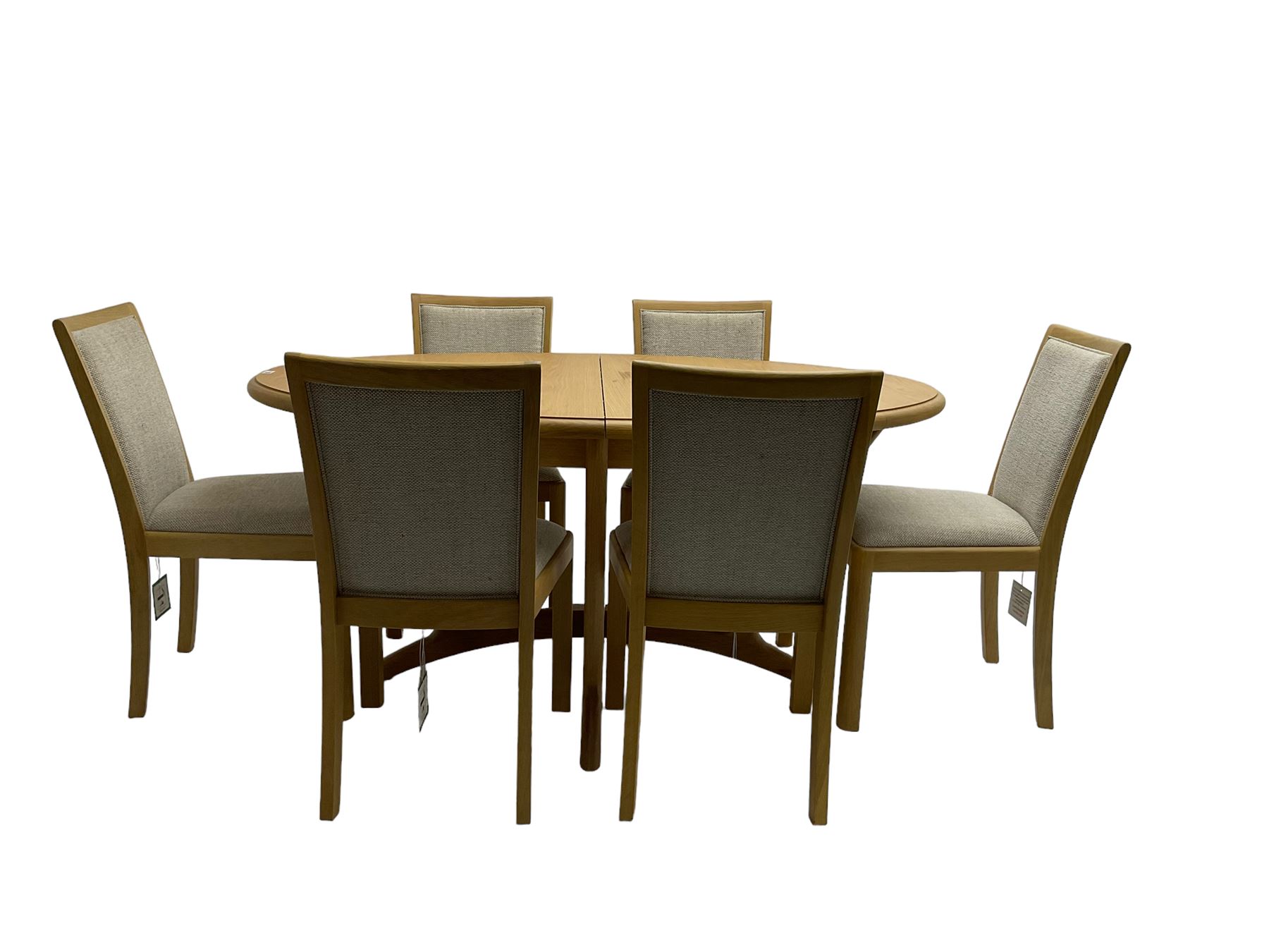Contemporary light oak oval extending dining table, shaped X-frame base (W160cm D102cm); and set of six light oak dining chairs, back and seat upholstered in textured pebble cream fabric (W50cm H90cm)