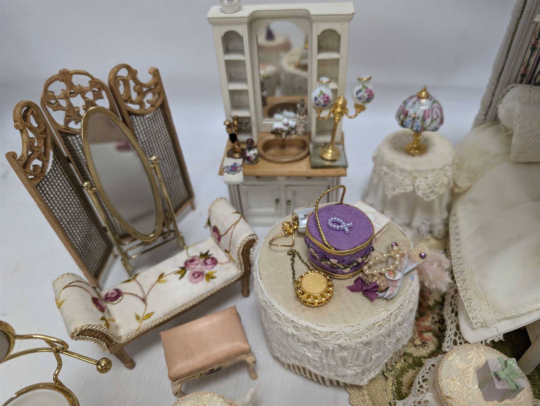 Dolls house bedroom and dressing room furniture, including beds, wardrobe, dressing table, lamps, tables, two figures and a collection of accessories