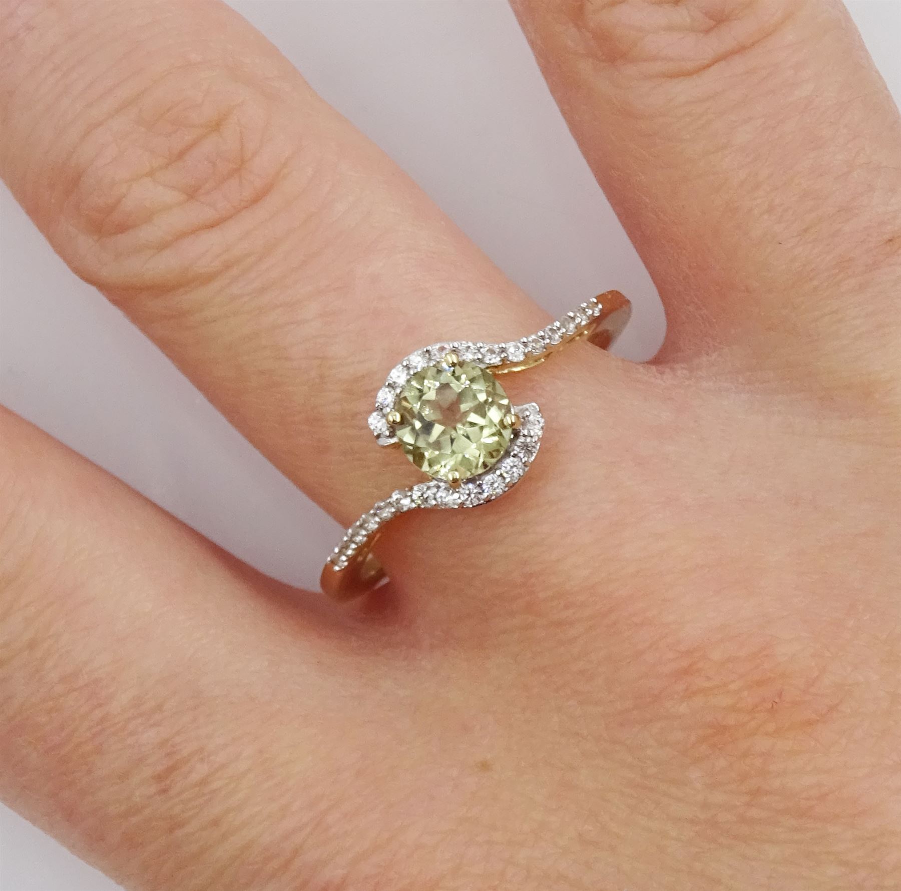 9ct gold csarite and white zircon crossover ring, hallmarked 