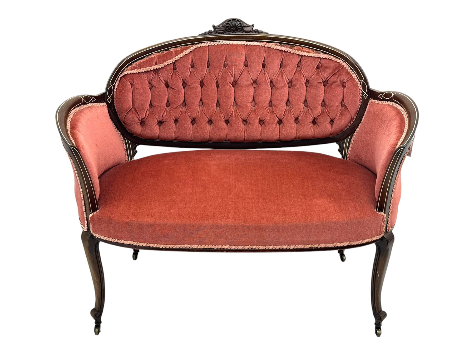 Edwardian inlaid rosewood parlour suite, comprising pair of tub shaped armchairs (W77cm, D69cm, H88cm); and matching two-seat sofa (W112cm, D69cm, H88cm), each with carved crest rails with shell motifs, deep button-tufted oval backs upholstered in pink fabric with braid trim, on cabriole supports