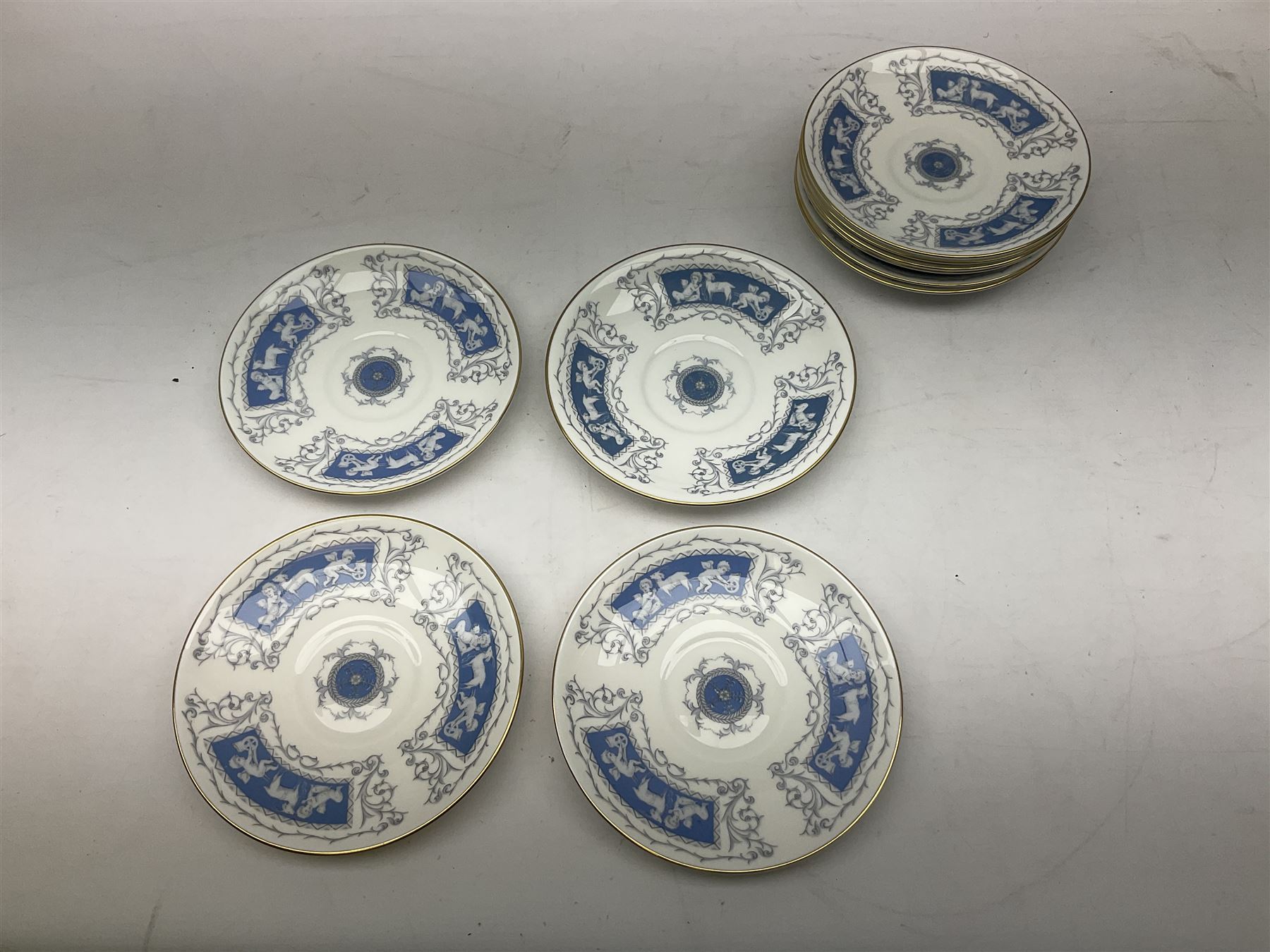 Coalport Revelry pattern tea and dinner wares, comprising nine dinner plates, four salad plates, eleven side plates, sauce boat and stand, ten teacups and ten saucers, and preserve pot and cover, together with a Coalport plate of shaped form decorated with pink roses, and a Royal Crown Derby Royal Antoinette pattern trio