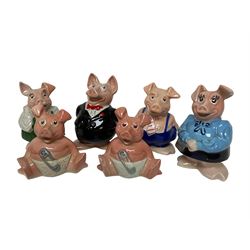 Six Wade NatWest money boxes, comprising father, mother, boy, girl and two baby examples