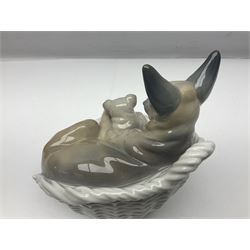 Lladro figure group, German Shepard with Pup, modelled as a dog and puppy in a basket, no. 4731, with printed mark beneath, H20cm