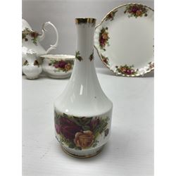 Royal Albert Old Country Roses pattern tea service for six, comprising teapot, sucrier, milk jug, dessert plates, one cake plate, one two tiered cake stand, salt and pepper pots and bud vase 