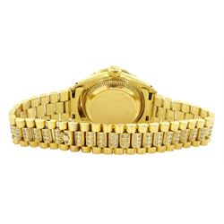 Rolex Oyster Perpetual Datejust ladies 18ct gold automatic wristwatch, circa 1983, Ref. 69178, serial No. 8058240, champagne dial diamond dot hour markers and outer diamond ring, after market diamond set bezel and lugs, on 18ct gold President bracelet, set with after market diamonds, with AIGL report and additional links