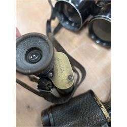 Four pairs of early 20th century binoculars, including Carl Zeiss Jena Feldstecher binoculars, Carl Zeiss Telact 8x binoculars, Dollond x5 field binolculars and one other pair, all in leather cases, one case marked with broad arrow, some with officers name etched