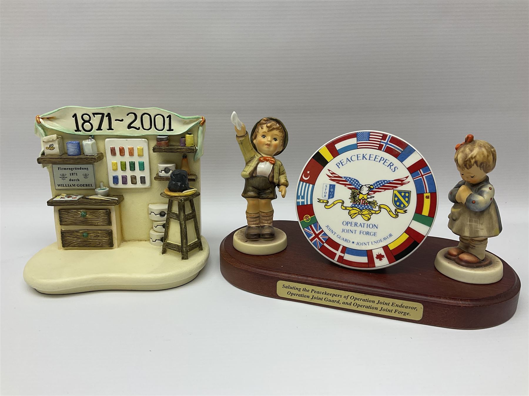 Thirty Hummel figures by Goebel, to include Saluting the Peacekeepers of Operation Joint Endeavor, on wooden plinth, Call to Glory, Celebrate with Song and Soldier Boy