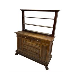 Early 20th century walnut side cabinet, rectangular top over fluted frieze, fitted with four drawers flanked by two narrow cupboards, gadroon carved lower plinth, on carved paw front feet, together with associated pine plate rack