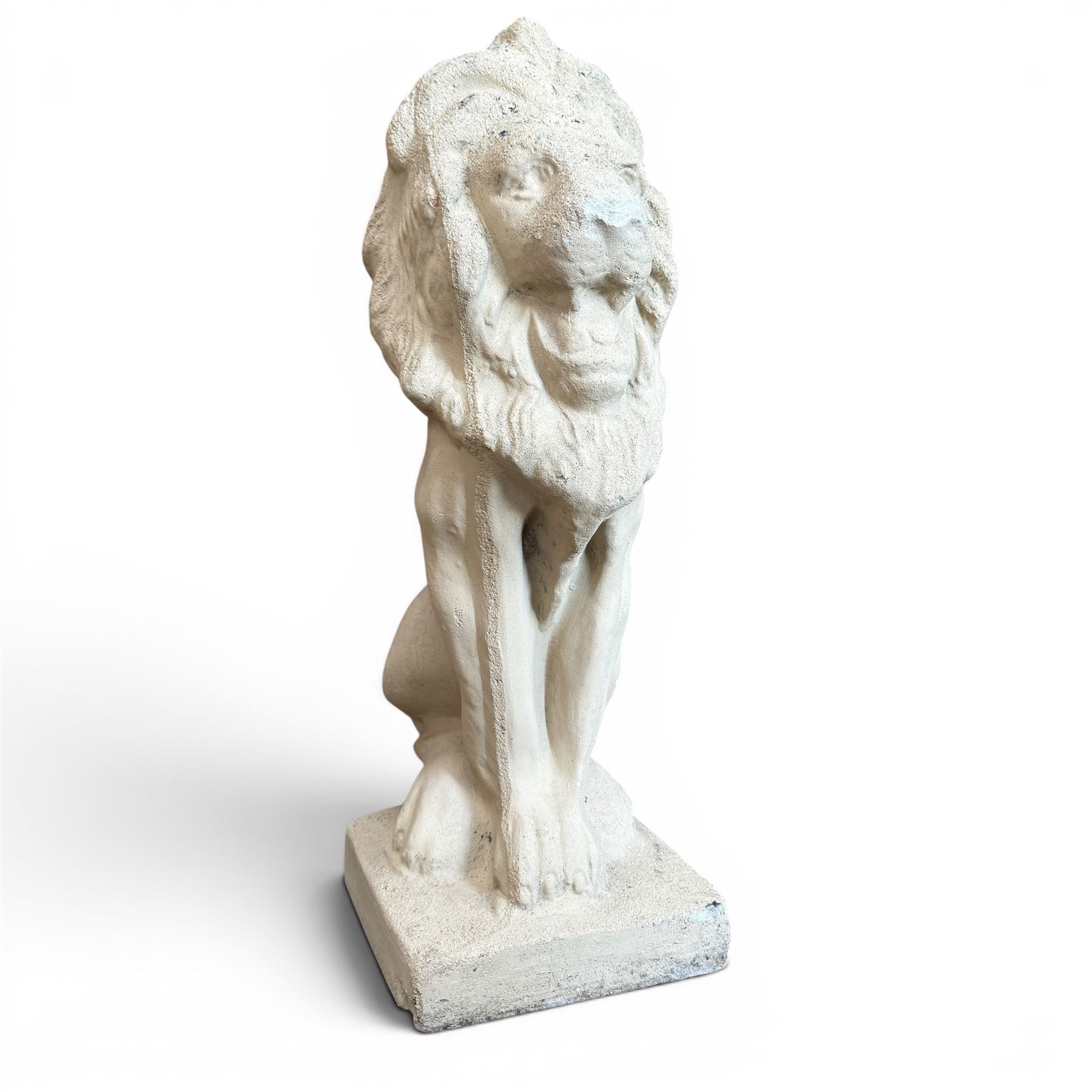 Pair of cast stone seat lions, male and female figure, and a miniature pair of cast stone lions