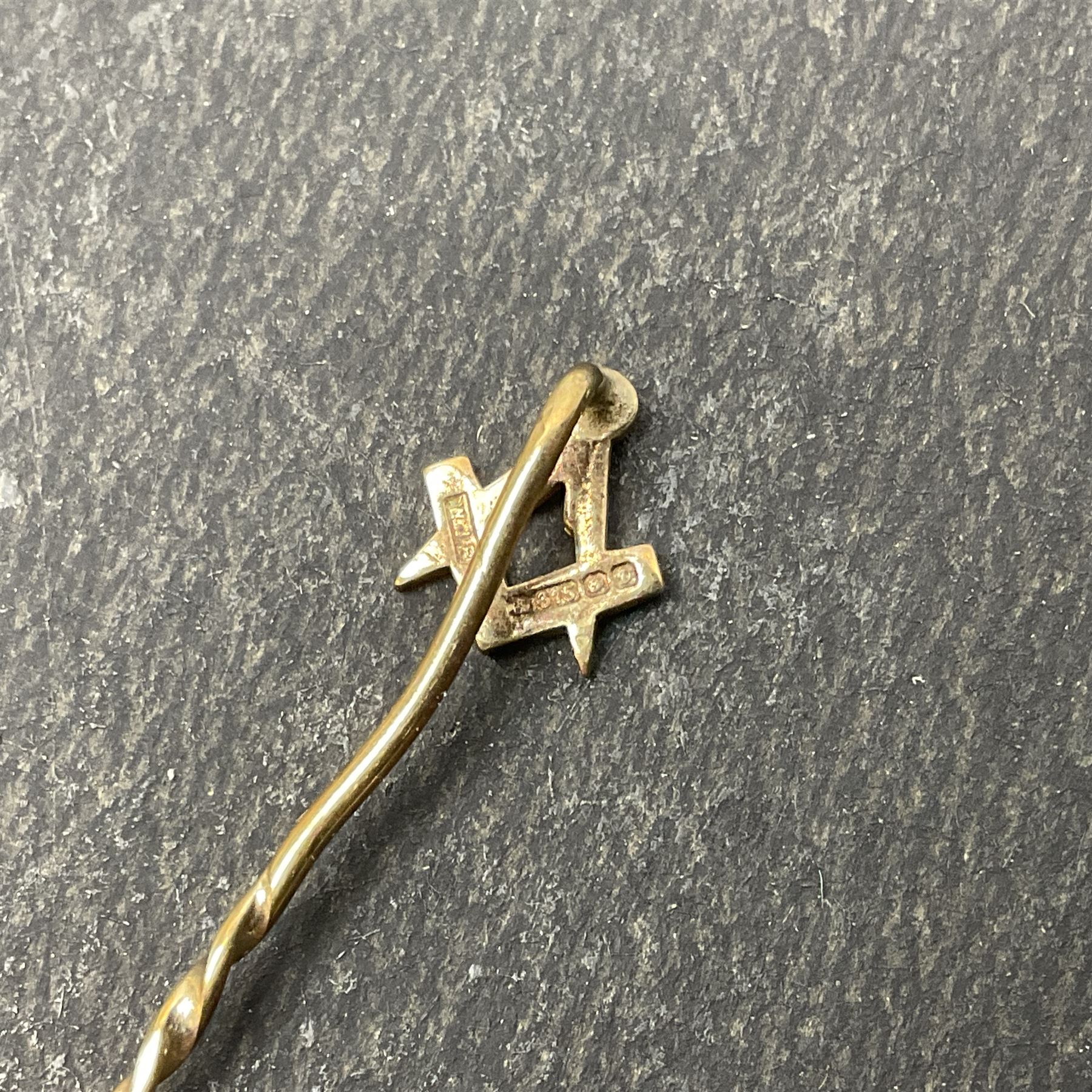 9ct gold Masonic Past Masters jewel, presented to 'W Bro Keith Leonard Hoggard by the bretheren of the Lodge St Andrew as a mark of esteem for valuable services rendered as worshipful master 1989-1990', hallmarked, together with a 9ct gold Masonic stick pin and stud