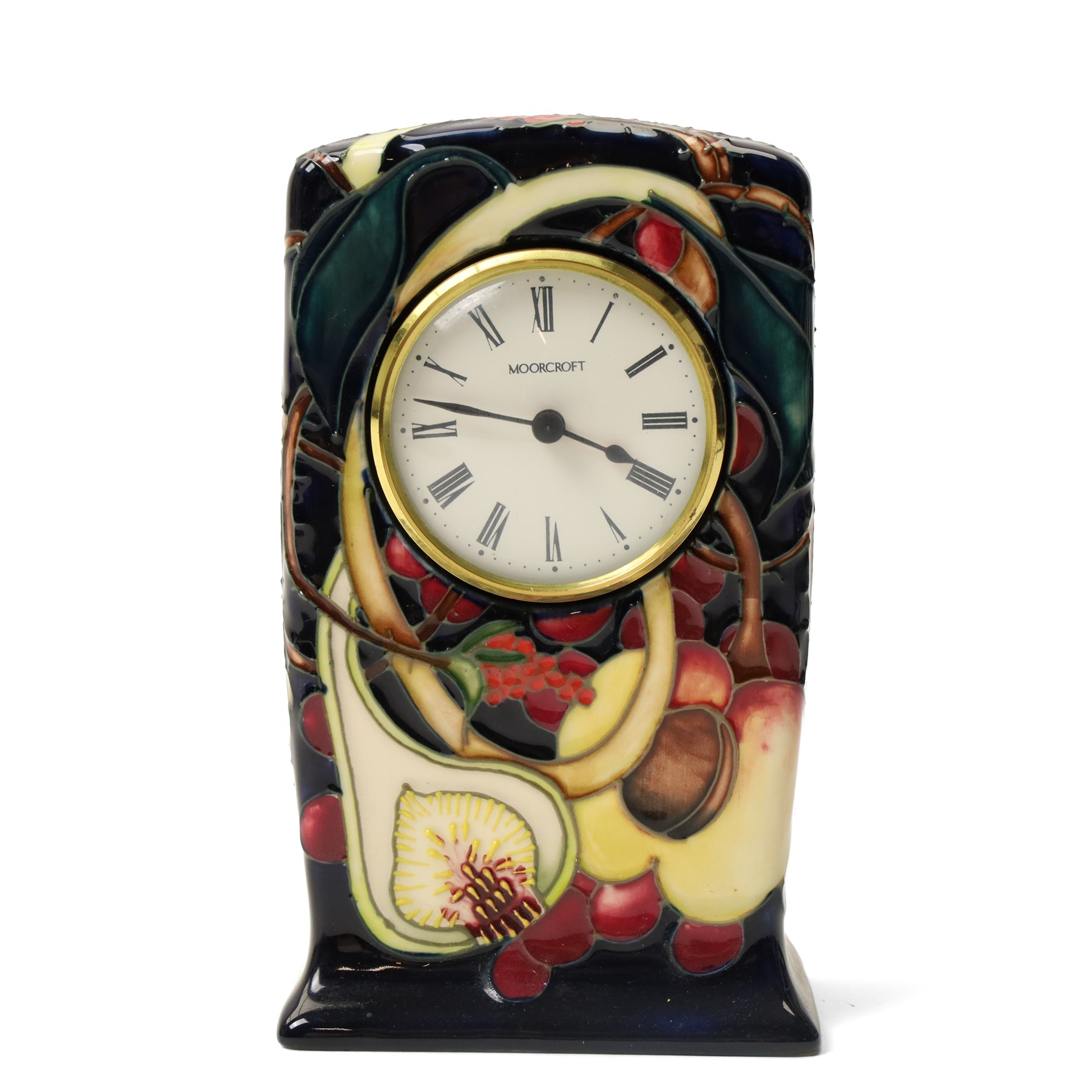Moorcroft Queens Choice pattern mantel clock, H16cm; together with an Anemone pattern pin tray, W20cm (2)