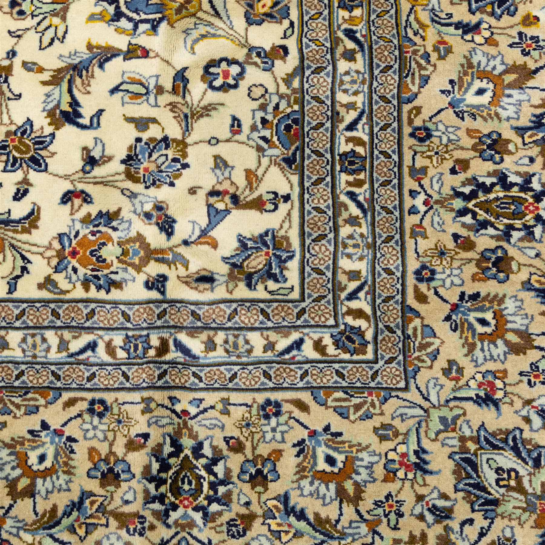 Central Persian Ardakan hand-knotted carpet, ivory field finely decorated with a symmetrical lattice of scrolling vines palmettes and flowering sprays arranged around a delicate central medallion enclosed by a pale border of stylized floral and vine ornament between multiple guard stripes with cotton fringe ends 