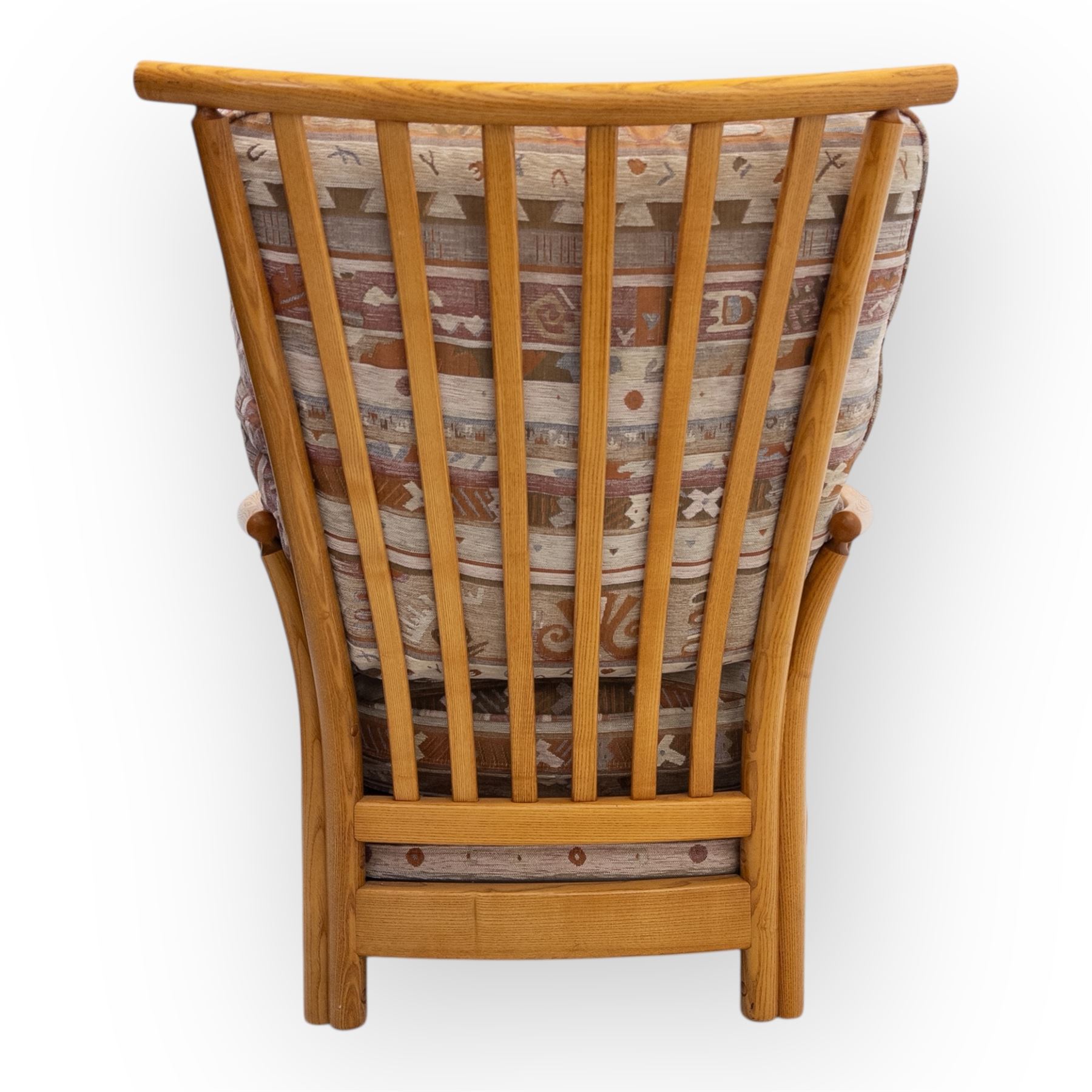 Ercol - Renaissance ash and elm high back armchair, upholstered in geometric Kilim patterned fabric with padded back, seat and arm cushions, curved stick back frame and turned supports