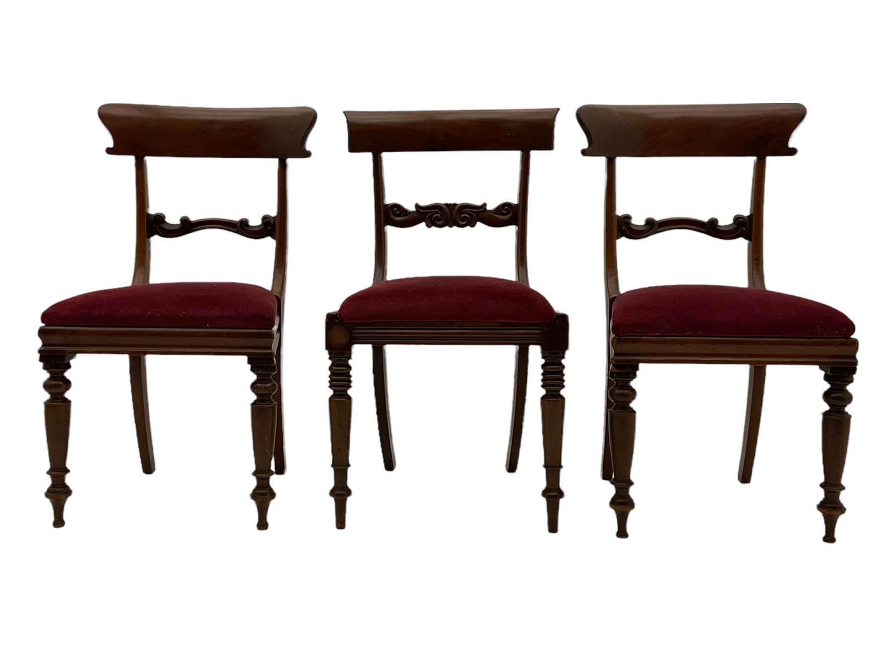 Seven early 19th century mahogany dining chairs - set six side chairs with scroll carved middle rails (W46cm), and a carver elbow chair with rope twist middle rail