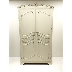 Late 20th century French style white and gilt double wardrobe,  shell carved cresting rail, two doors enclosing fitted interior, shaped bracket supports