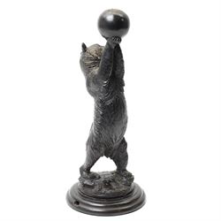 Black forest carving of a circus bear, holding aloft a ball, standing, H35cm