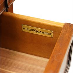 Willis & Gambier - pair of 'Directoire' cherry wood bedside tables, rectangular top with cock-beaded edge over two panelled facia drawers, raised on square turned and tapering supports on brass feet