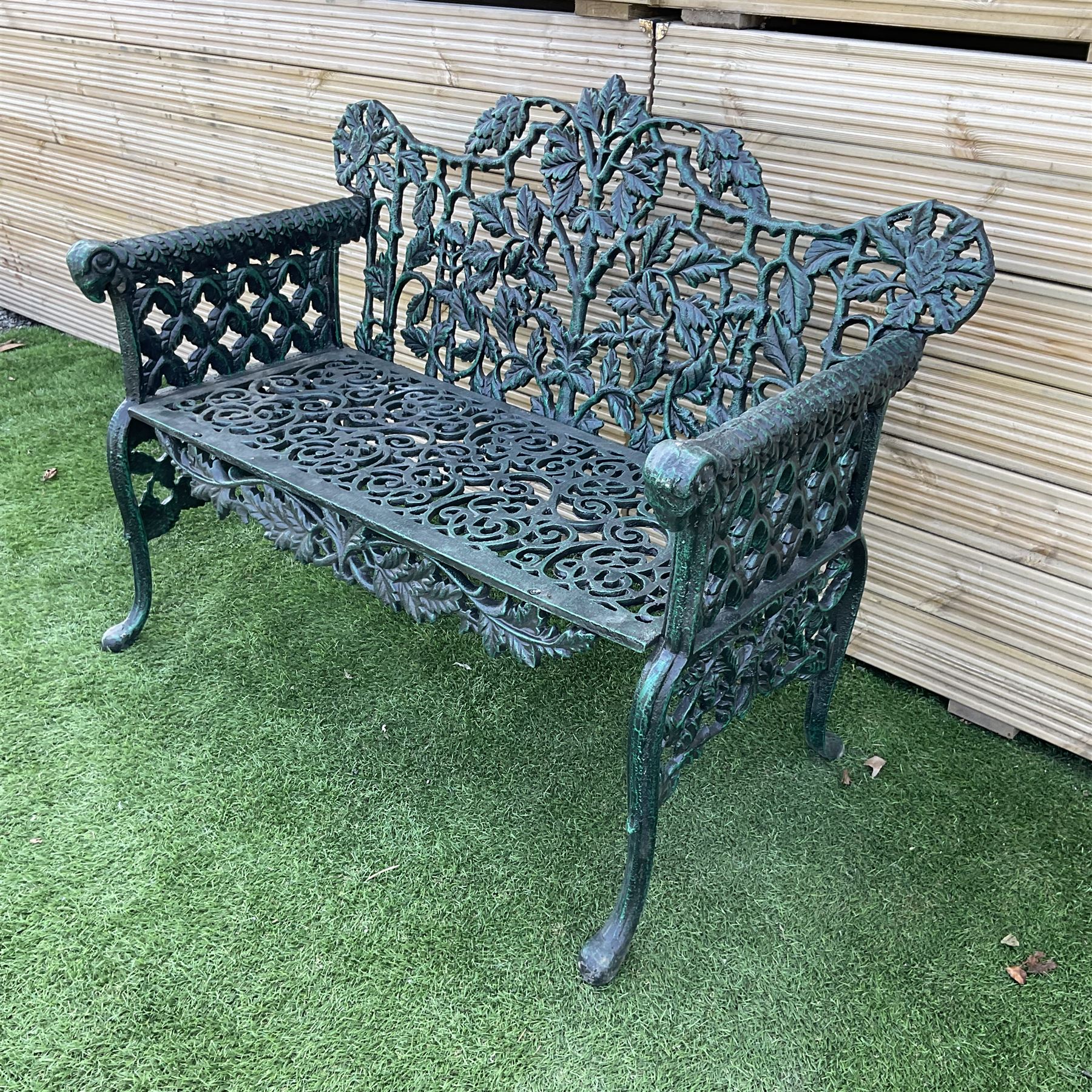 Victorian design heavy cast iron garden bench, ornate shaped back with rope twist and ramshead arms H88cm, W100cm - THIS LOT IS TO BE COLLECTED BY APPOINTMENT FROM DUGGLEBY STORAGE, GREAT HILL, EASTFIELD, SCARBOROUGH, YO11 3TX