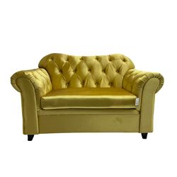 Chesterfield shaped snuggler sofa, upholstered in buttoned gold fabric, with scatter cushions