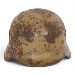 WWII German Third Reich M1940 helmet, with desert camouflage, the left inner brim stamped SE64, the back inner brim stamped 506, with leather eight tongue liner, together with German M34 helmet