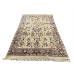 Persian style beige ground rug, central medallion, repeating border