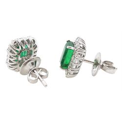 Pair of 18ct white gold emerald and diamond cluster stud earrings, octagonal cut emeralds, with round brilliant cut and baguette cut diamond surround, total emerald weight approx 2.30 carat, total diamond weight approx 0.70 carat