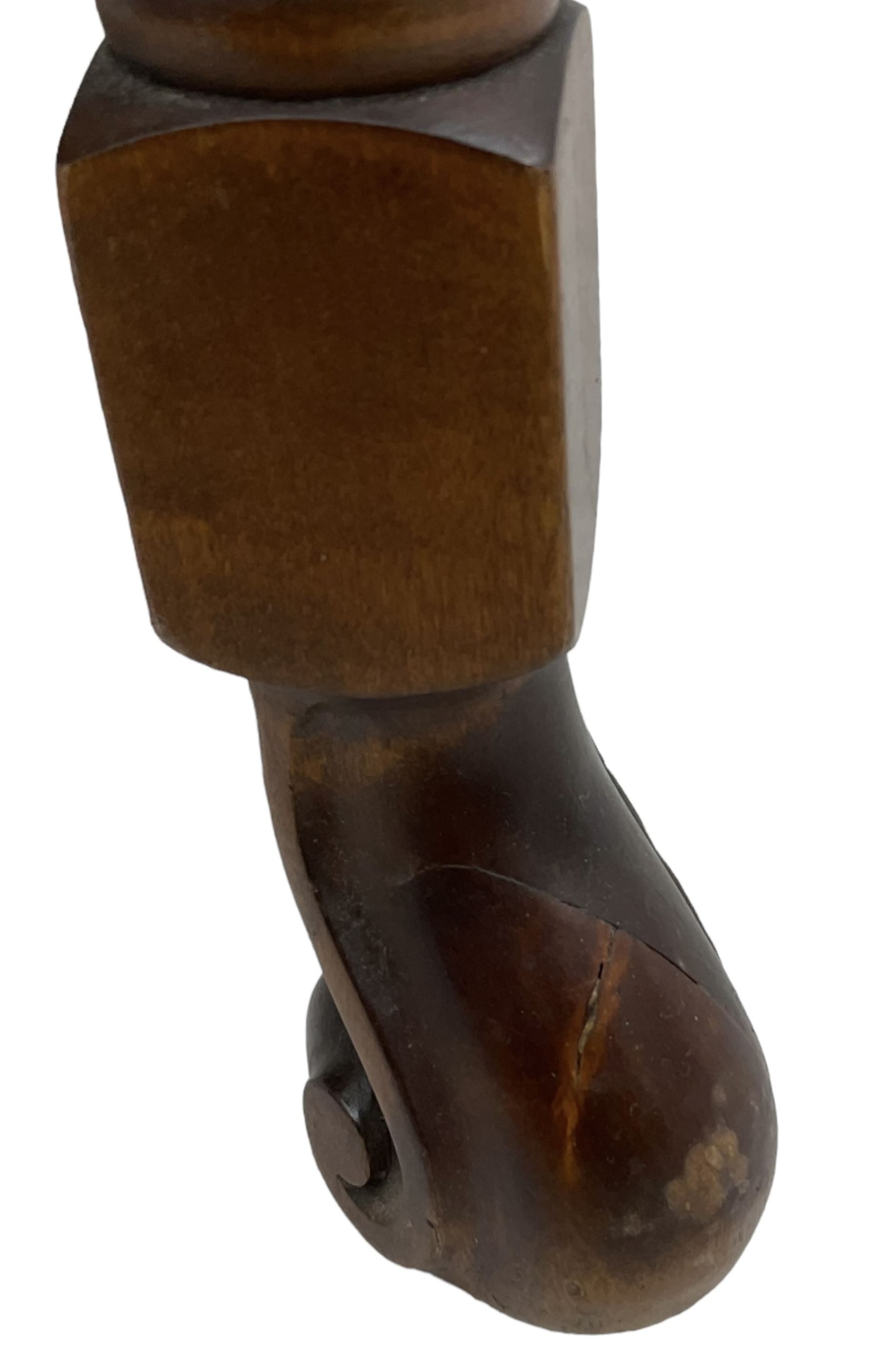 Early 20th century stained beech framed armchair, cane panel back over scrolled arm terminals, raised on turned supports united by turned H-stretcher, with patterned blue upholstered loose back and seat cushions