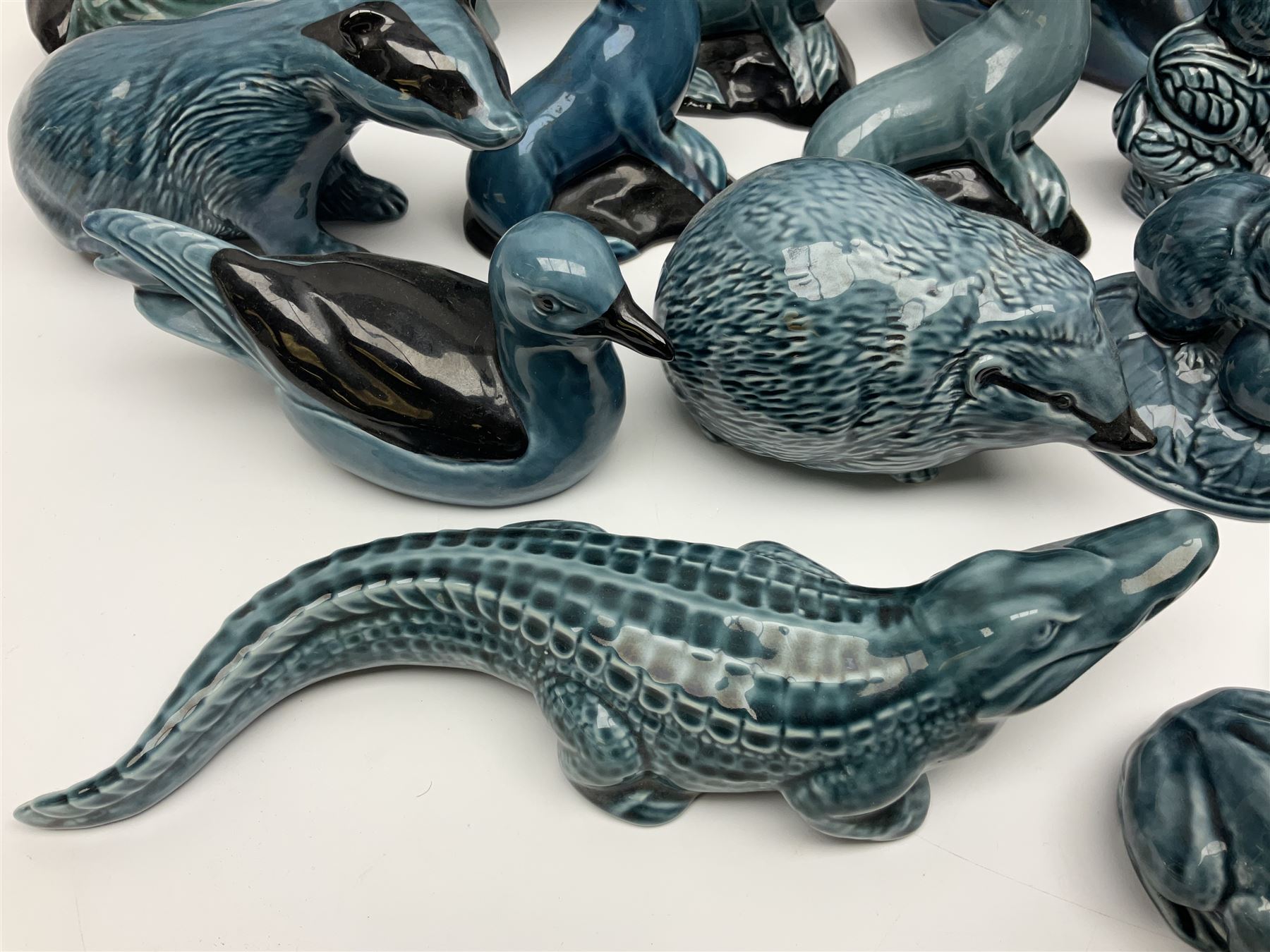 Collection of Poole pottery animals, including frogs, owls, otters, dolphins, mice etc, all with printed mark beneath (23)