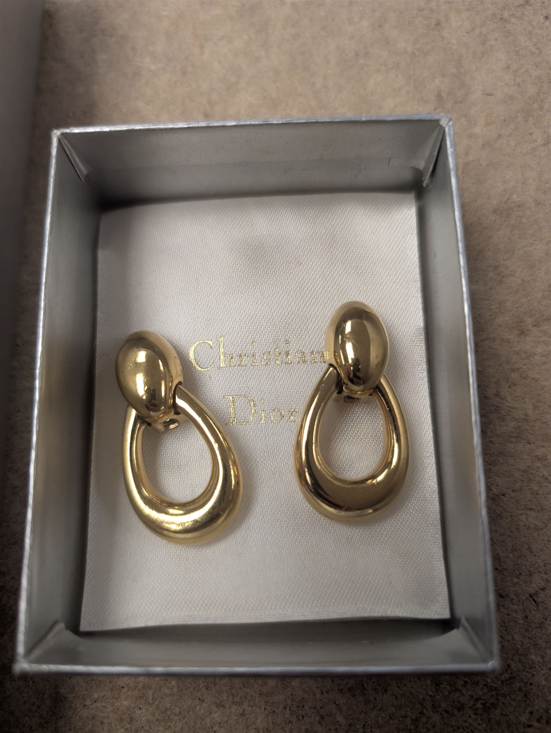 Pair of Christian Dior clip on hoop earrings, stamped Chr.Dior, together with a faux pearl necklace and similar clip on earrings, stamped Grosse, both within Christian Dior boxes