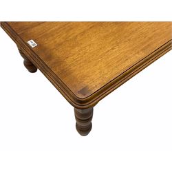 Contemporary hardwood coffee table, moulded rectangular top on turned supports