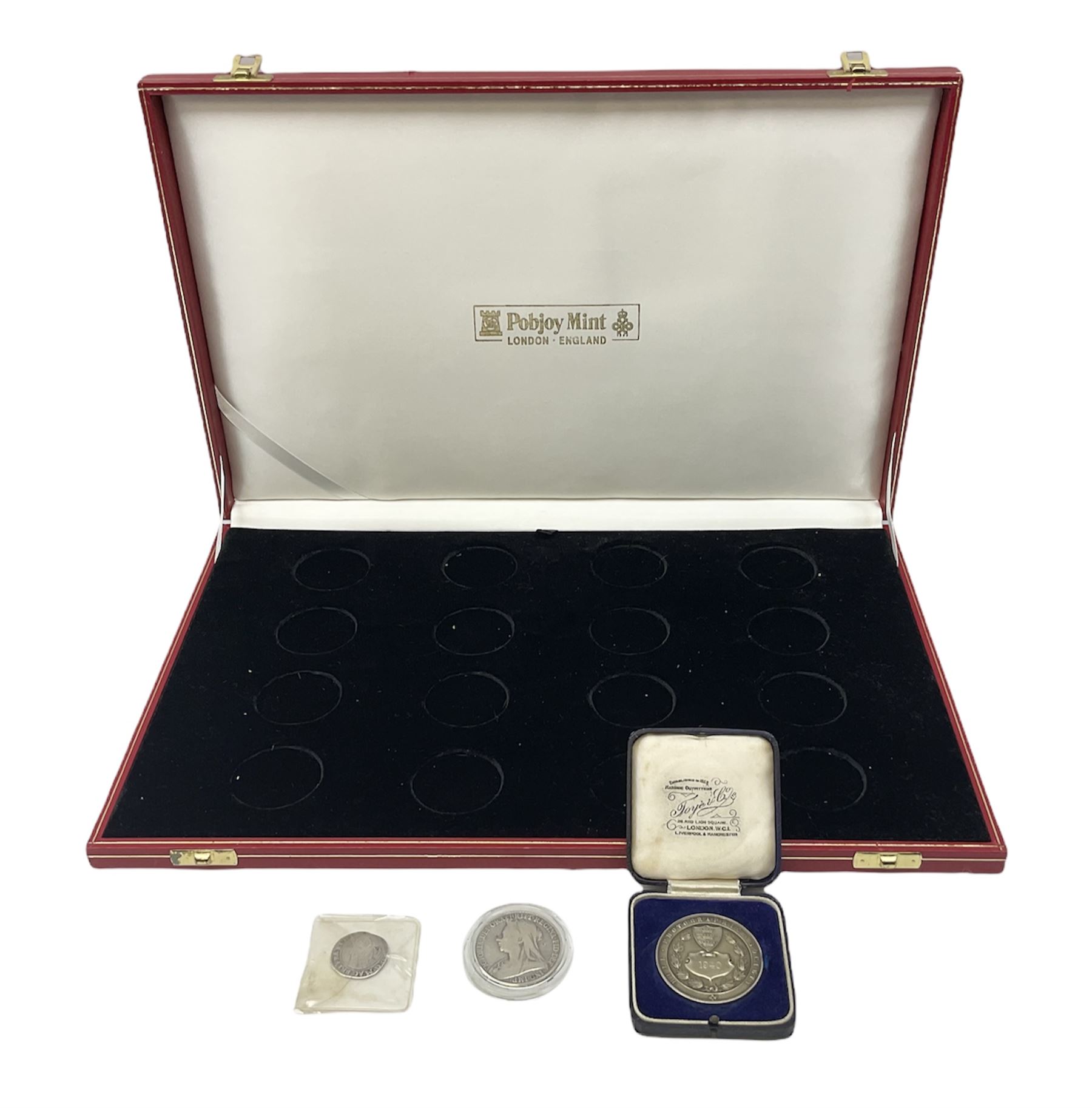 Charles I 1625 hammered silver sixpence, Queen Victoria 1894 crown coin and a cased hallmarked silver medal for the Hull photographic society, engraved '1940' 'Leonard Vokes', all housed in a red Pobjoy Mint coin box