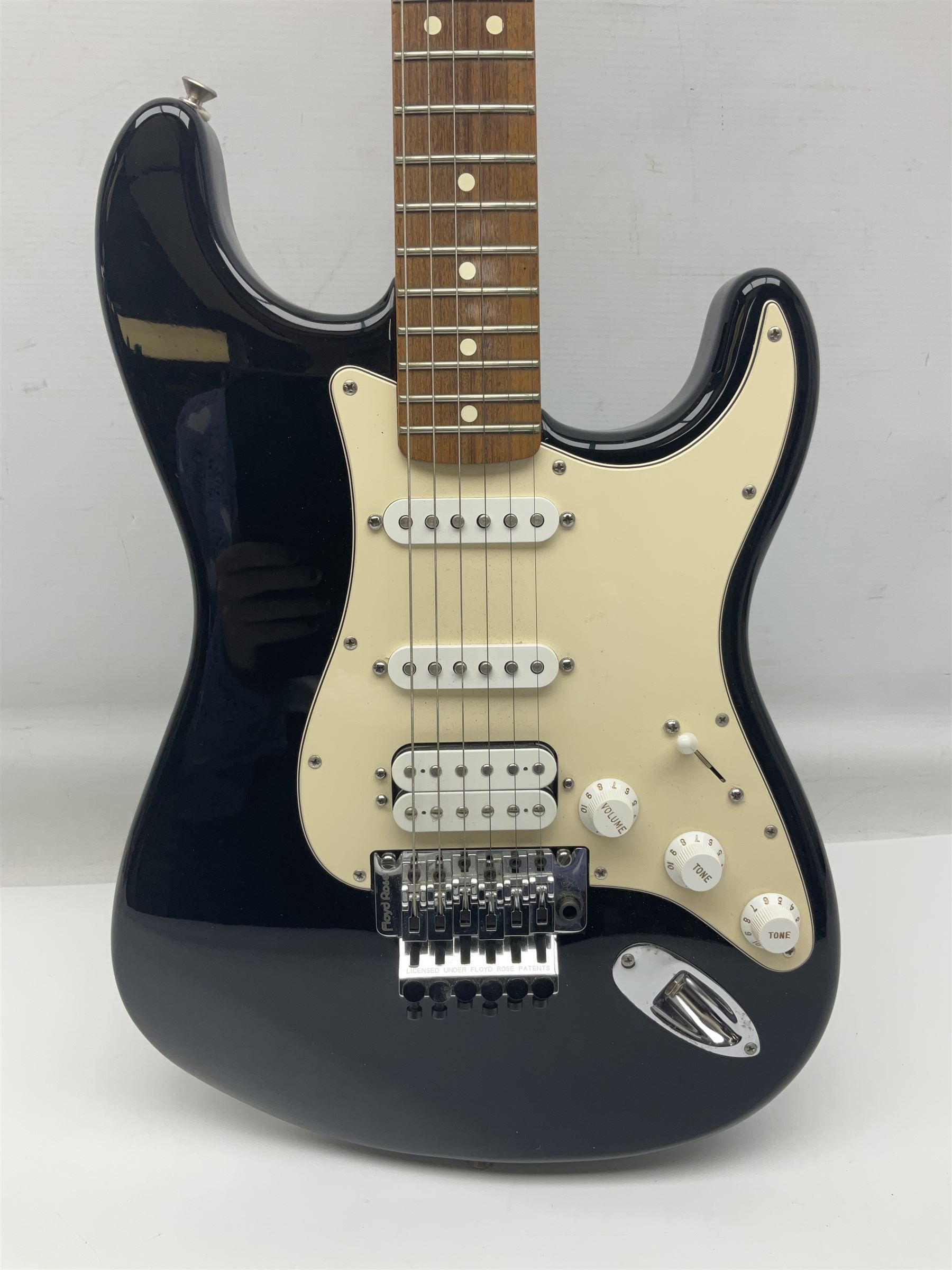 Mexican Fender Stratocaster electric guitar in black c2003 with Floyd Rose tremolo system, serial no.MZ3129600; L98cm; in Freestyle fitted case with 2006 Diamond Anniversary booklet