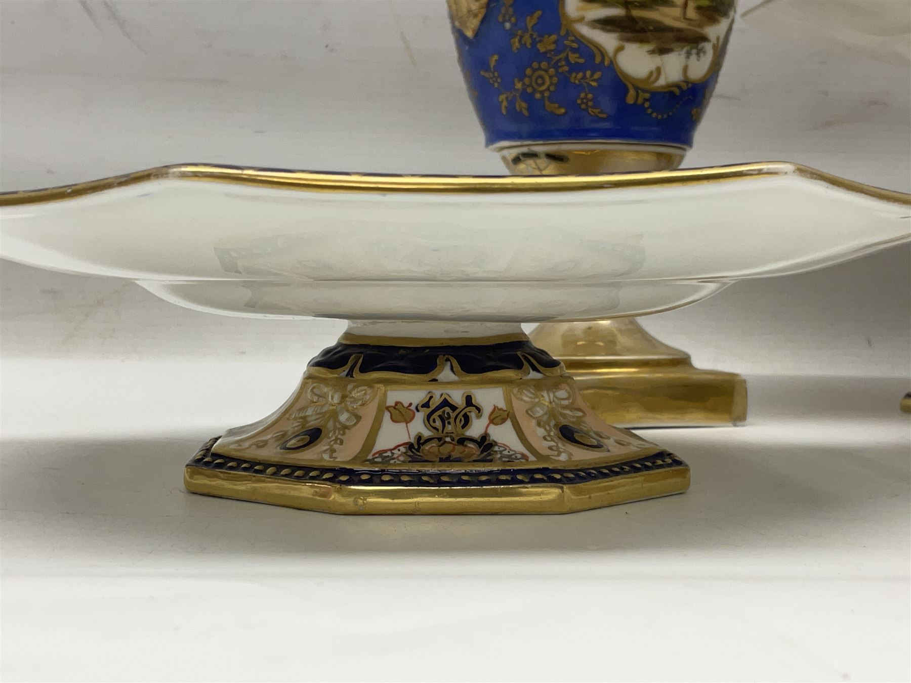 Devonport imari pattern comport set, comprising two tall comports and three low comports, together with twin handled pedestal ovoid vase, decorated with landscape with gilt swan handles, vase H25cm