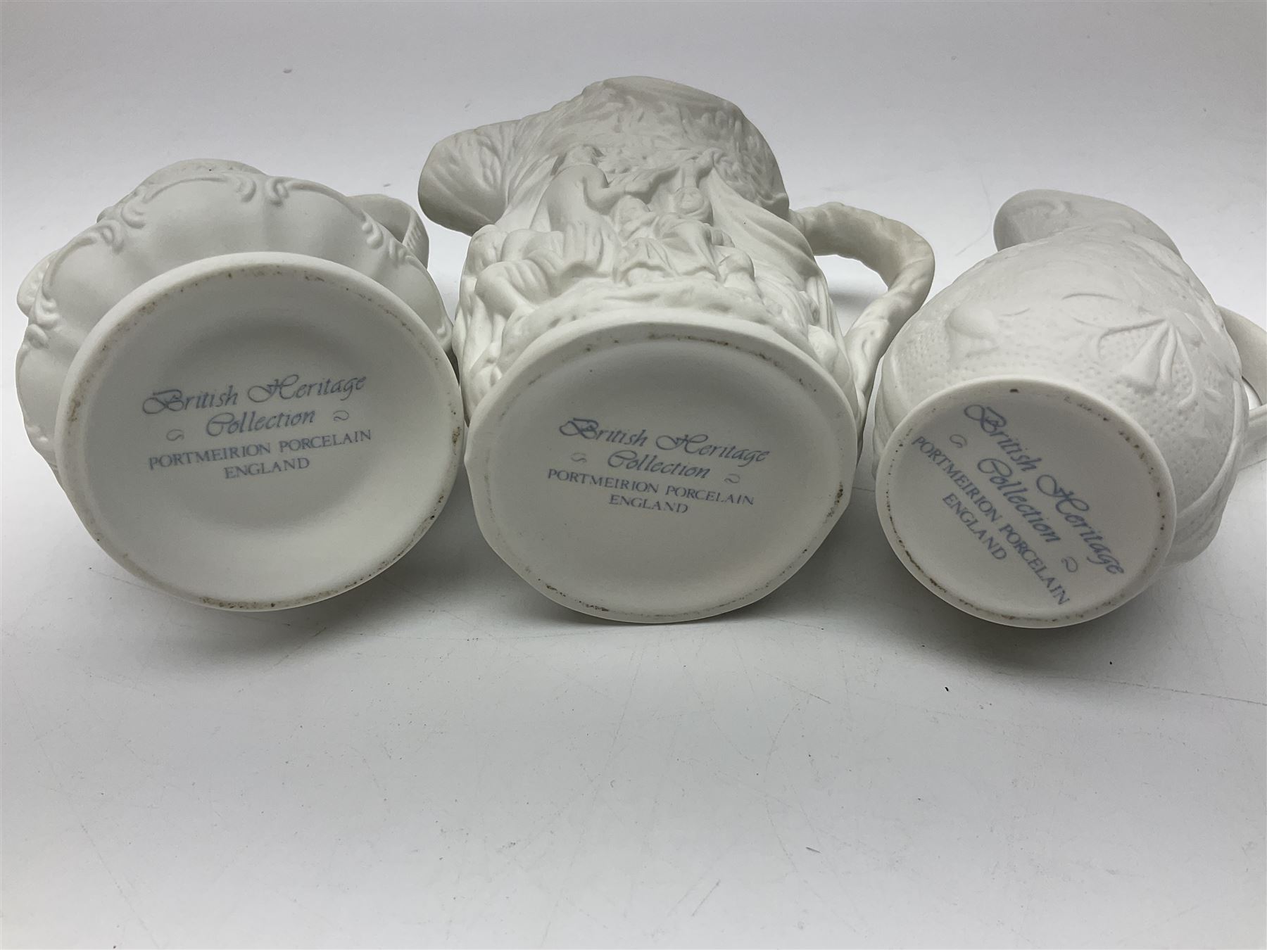  Six Portmeirion British Heritage Collection parian jugs, of various designs, H12cm