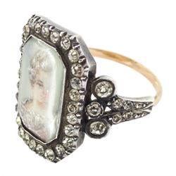 19th century 18ct gold and silver paste set portrait ring, octagonal miniature of a woman on ivory, under a glazed panel, with paste stone surround, to bifurcated paste set shoulders. This lot has been registered for sale under Section 10 of the APHA Ivory Act