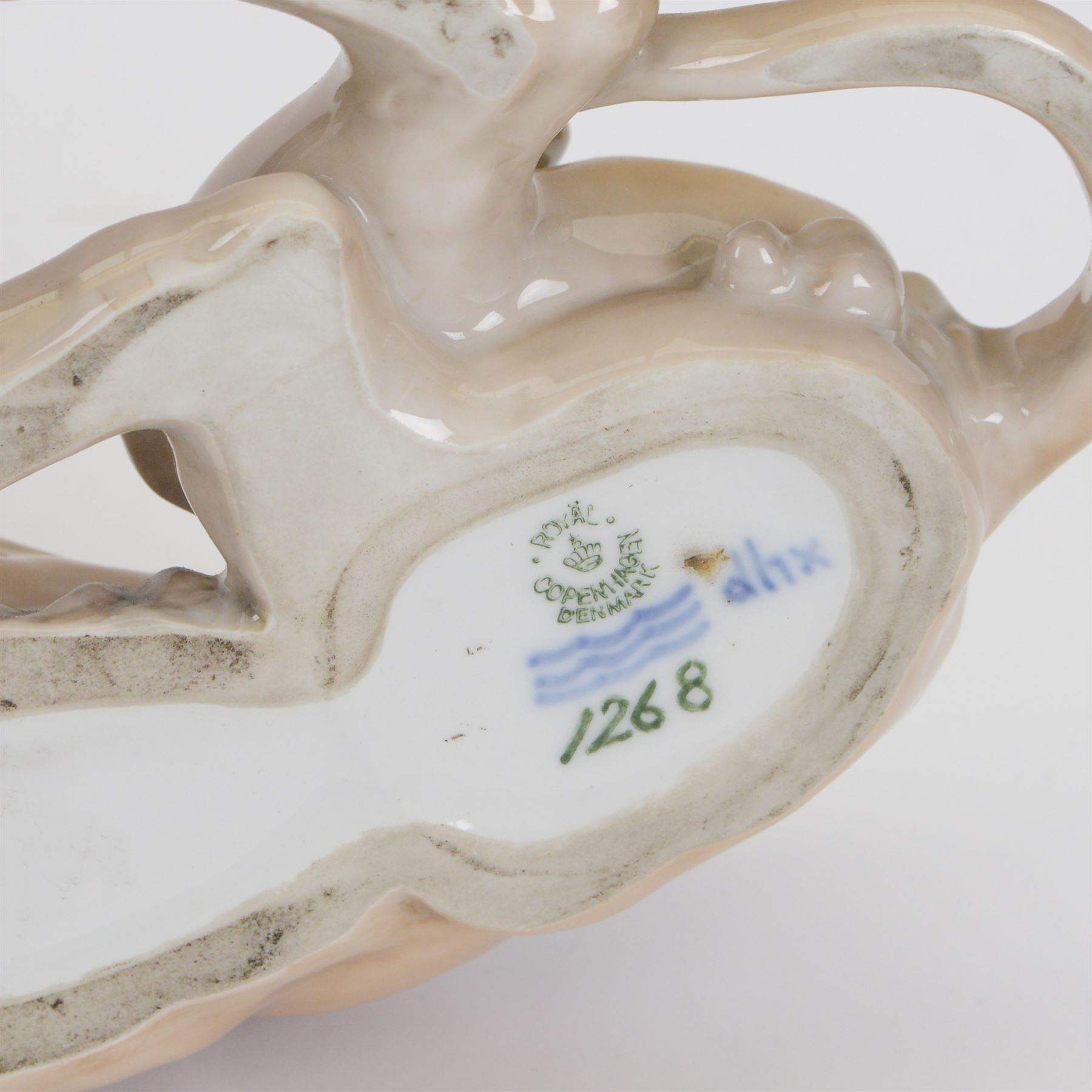 Royal Copenhagen recumbent lion, no.1268, with printed marks beneath H16cm