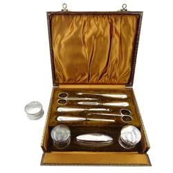 Silver mounted manicure set by Samuel M Levi, Birmingham 1925, in velvet lined case and a silver napkin ring hallmarked