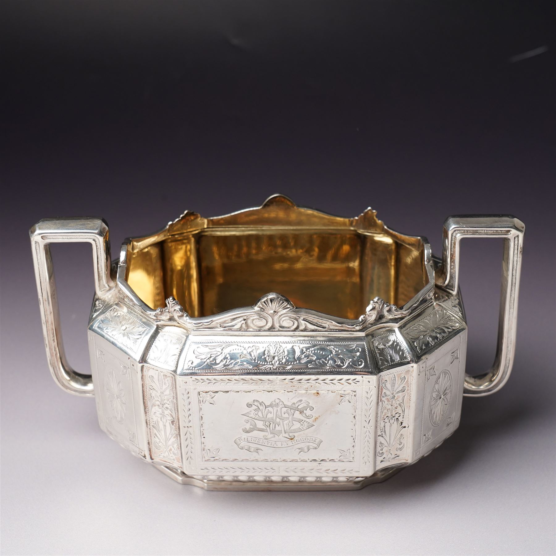 Victorian silver tea and coffee set engraved with classical urns, oval paterae and scrolling foliage, monogram and 'Diligentia et Honore' comprising teapot, tea kettle on spirit heater stand, coffee pot, two handled sugar bowl and cream jug Sheffield 1891 Maker John Round & Son Ltd