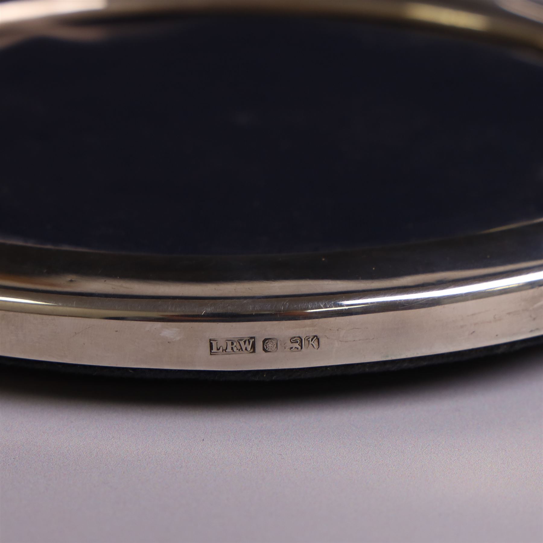 Four late 20th century silver mounted photograph frames, comprising two oval frames and pair of smaller circular frames, all hallmarked Laurence R Watson & Co, Sheffield 1983/4, largest H16.5cm