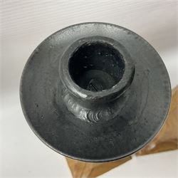 Mouseman - pair of tooled oak candlesticks, wrought iron sconce with drip tray over tapered octagonal column carved with mouse signature, terminating to stylised leaf carved square base, by the workshop of Robert Thompson, Kilburn
