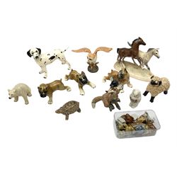 Three West German figures of Boxer dogs,