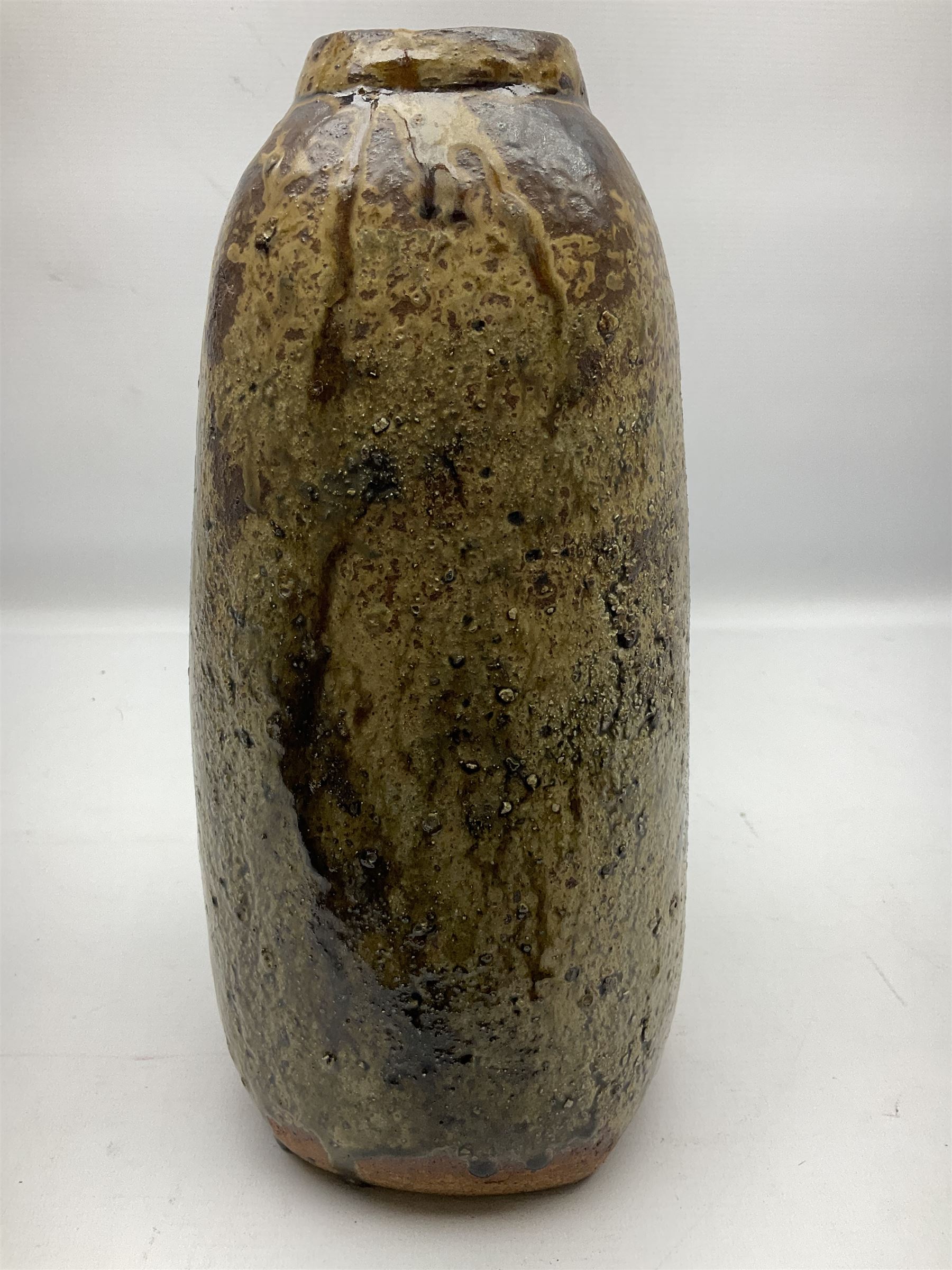 Janet Leach (American, 1918-1997) for Leach Pottery; studio pottery Bizen style vase of tapering form, the stoneware body decorated in a mottled green and brown dripped ash glaze, with impressed J.L. monogram and stamp marks beneath, H30cm