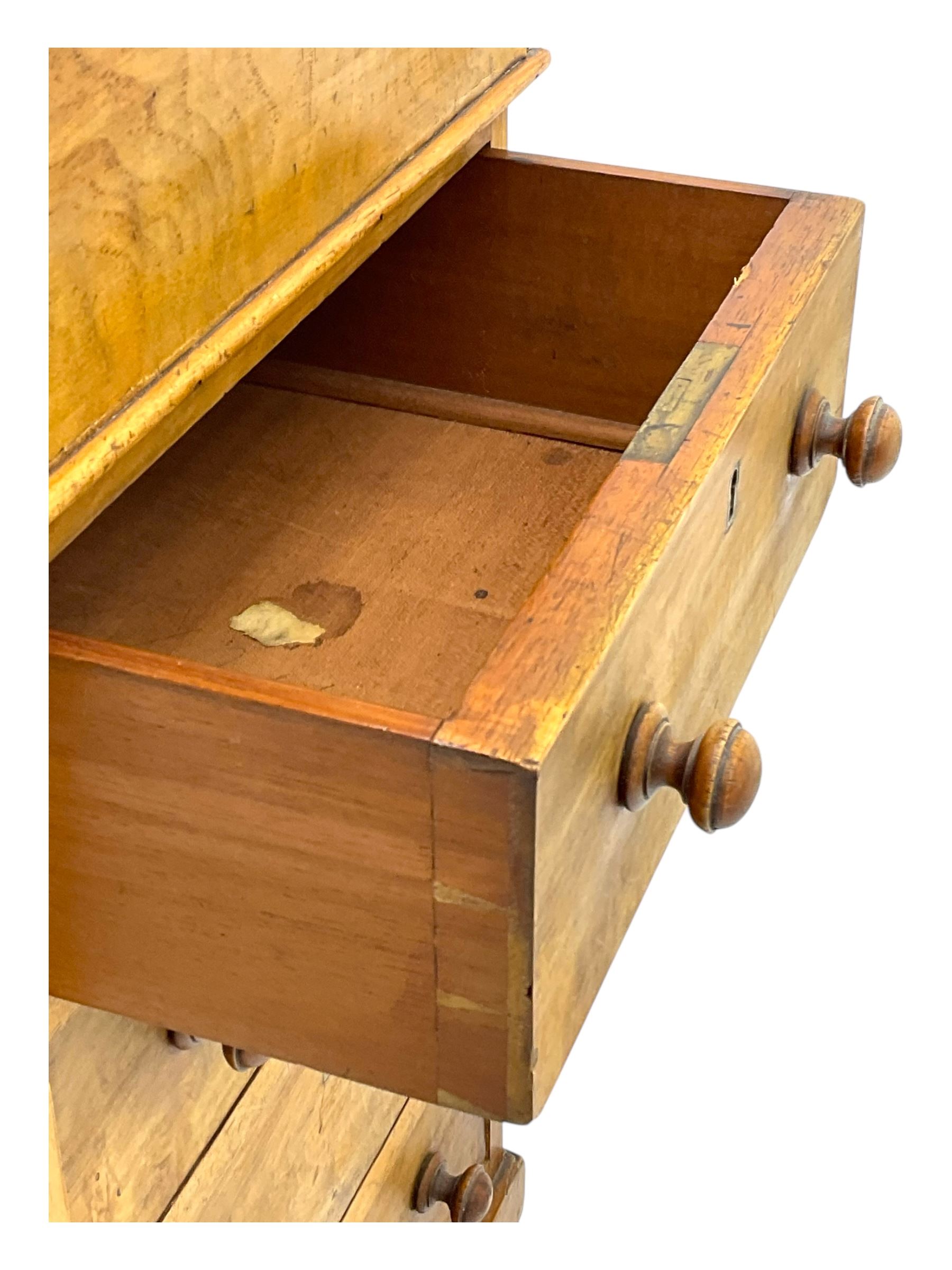 Early 19th century burr walnut Davenport desk, sloped leather-inset writing surface with brass gallery, fitted with an inkwell compartment and pen slot, four drawers to one side, raised on scrolled supports terminating in castors